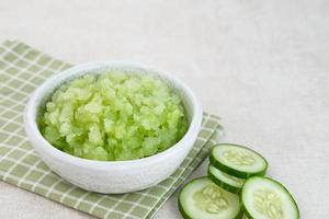 Organic cucumber pulp juice, squeezed from a slow juicer, can be used as a face mask, zero waste. Selected focus. photo