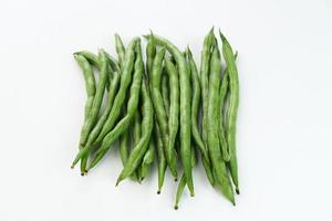 Buncis or Fresh raw string bean, legumes contain protein on white background. photo