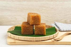 Wajik, traditional Indonesian snack made from steamed sticky rice, palm sugar, coconut milk, and pandan leaves. Selected focus. photo