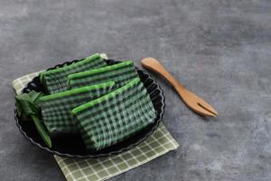 Kue Lapis Pandan or Kue Pepe or sticky layer cake, Indonesian traditional snack made from rice flour photo
