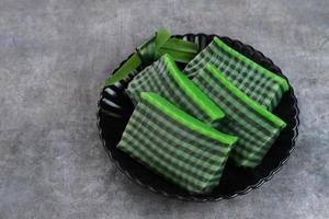 Kue Lapis Pandan or Kue Pepe or sticky layer cake, Indonesian traditional snack made from rice flour photo