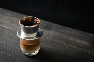 Hot milk coffee dripping in Vietnam style photo