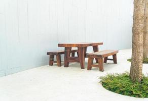 empty wood outdoor patio table and chair set photo