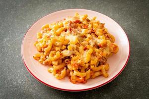 homemade macaroni bolognese with cheese photo