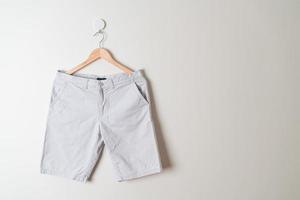 short pants hanging on wall photo