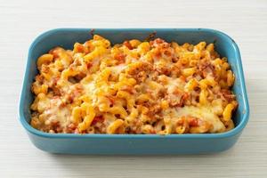 homemade macaroni bolognese with cheese photo