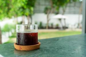iced americano coffee glass on table