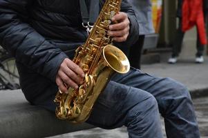 A Street Musician is playing in the street photo