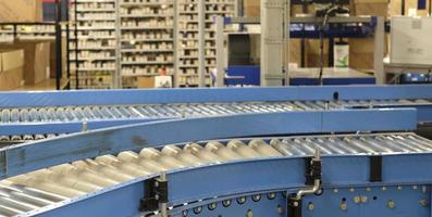 Conveyor belt inside a manufacturing site or distribution warehouse photo