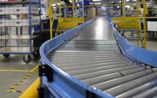 Conveyor belt inside a manufacturing site or distribution warehouse photo