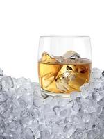 Glass of whiskey, ice cubea. Drinks to entertain at parties photo