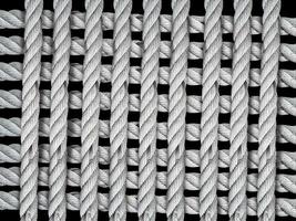 Rope in the form of a grid on black background photo