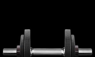 black dumbbell in on a black background and free space for your text photo