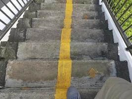 Man walking down on stairs photo