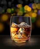 Glass of whiskey on a wooden table bar background abstract bokeh lights with soft light. 3d render
