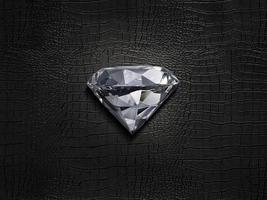 Heart shaped diamond, on a black leather background photo