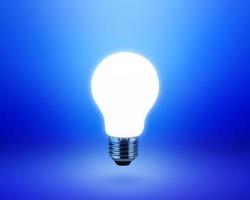 light bulb on blue background idea concept photo