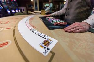 gambling chips and cards on a game table roulette photo