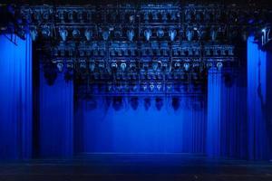Interior of a white conference concert hall or theatre with blue scene photo