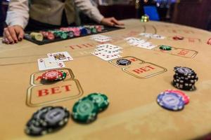 gambling chips and cards on a game table roulette photo