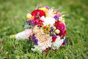 Beautiful wedding bridal bouquet of blue and white roses and other flowers photo