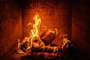 Fire flames in fireplace background photo