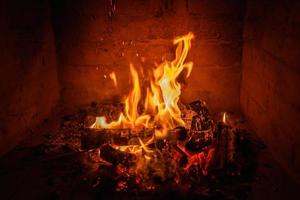 Fire flames in fireplace background photo