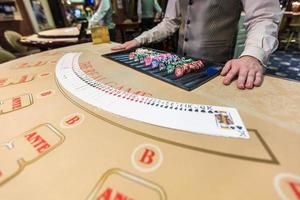 gambling chips and cards on a game table roulette photo