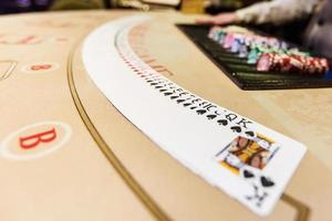 gambling chips and cards on a game table roulette photo