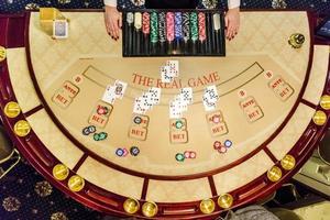 gambling chips and cards on a game table roulette photo