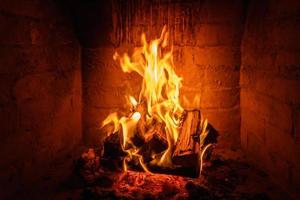 Fire flames in fireplace background photo