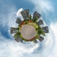 Little planet.  Spherical aerial view  with skyscrapers  in beautiful day with nice clouds photo