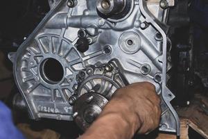 The mechanic is checking the engine. photo