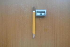 pencil and a razor on a table photo