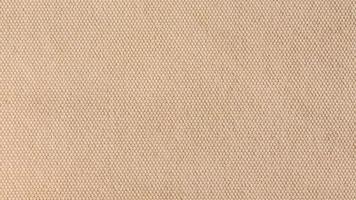 close-up Texture of light brown canvas fabric as background photo