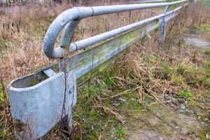 Road barrier with protective stake photo