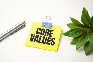 yellow sticker with the text core values and charts photo