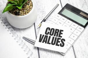 core values Written words on paper notebook . workplace. Business concept. photo
