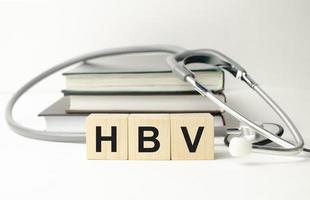 word HBV on wooden blocks. medical concept . the medicine photo