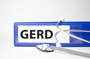 gerd word on file folder and stethoscope on white background photo