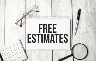 FREE ESTIMATES word on notebook and calculator photo