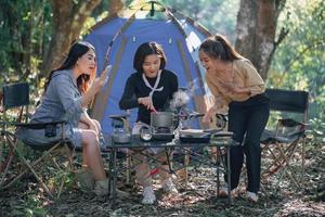 three bestie go camping in the forest photo