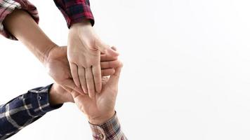 young business people putting their hands together photo