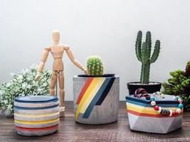 Retro style geometric planters. Painted concrete planters for home decoration photo