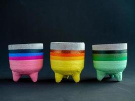 Colorful concrete planters. Painted concrete pots for home decoration photo