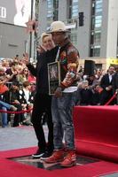 LOS ANGELES, DEC 4 - Ellen DeGeneres, Pharrell Williams at the Pharrell Williams Hollywood Walk of Fame Star Ceremony at the W Hotel Hollywood on December 4, 2014 in Los Angeles, CA photo