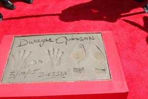 LOS ANGELES, MAY 19 - Dwayne Johnson hand and footprints at the Dwayne Johnson Hand and Foot Print Ceremony at the TCL Chinese Theater on May 19, 2015 in Los Angeles, CA photo