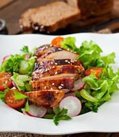 Fresh vegetable salad with grilled  chicken breast. photo