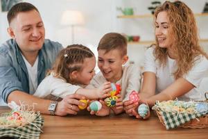 Father, mother, son and daugher. Happy family celebrating Easter holidays together photo