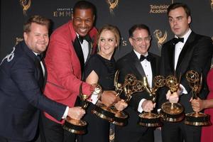LOS ANGELES - SEP 9  James Corden photobombing Samantha Bee Show Writing Team at the 2017 Creative Emmy Awards Press Room at the Microsoft Theater on September 9, 2017 in Los Angeles, CA photo